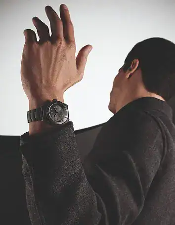 Man wearing a black Tudor watch on his wrist - Washington Watches